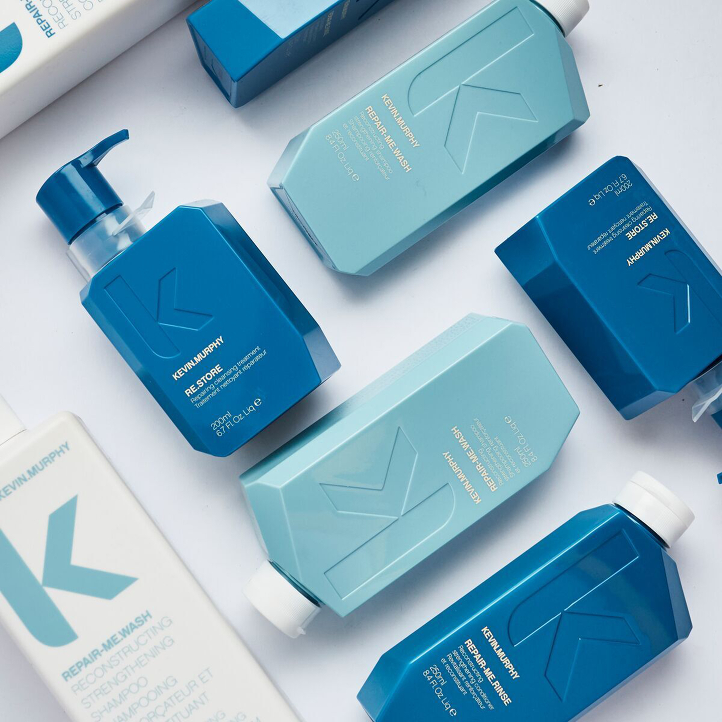 Assorted KEVIN.MURPHY hair care products for damaged hair repair.